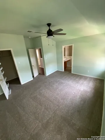 a view of an empty room and a windows