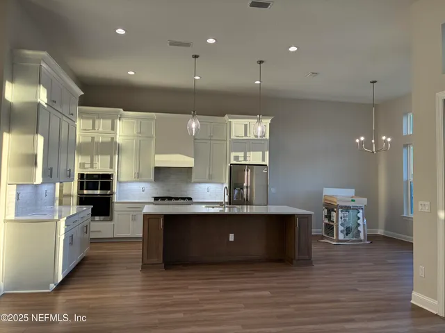 a bathroom with a sink a toilet and bathtub