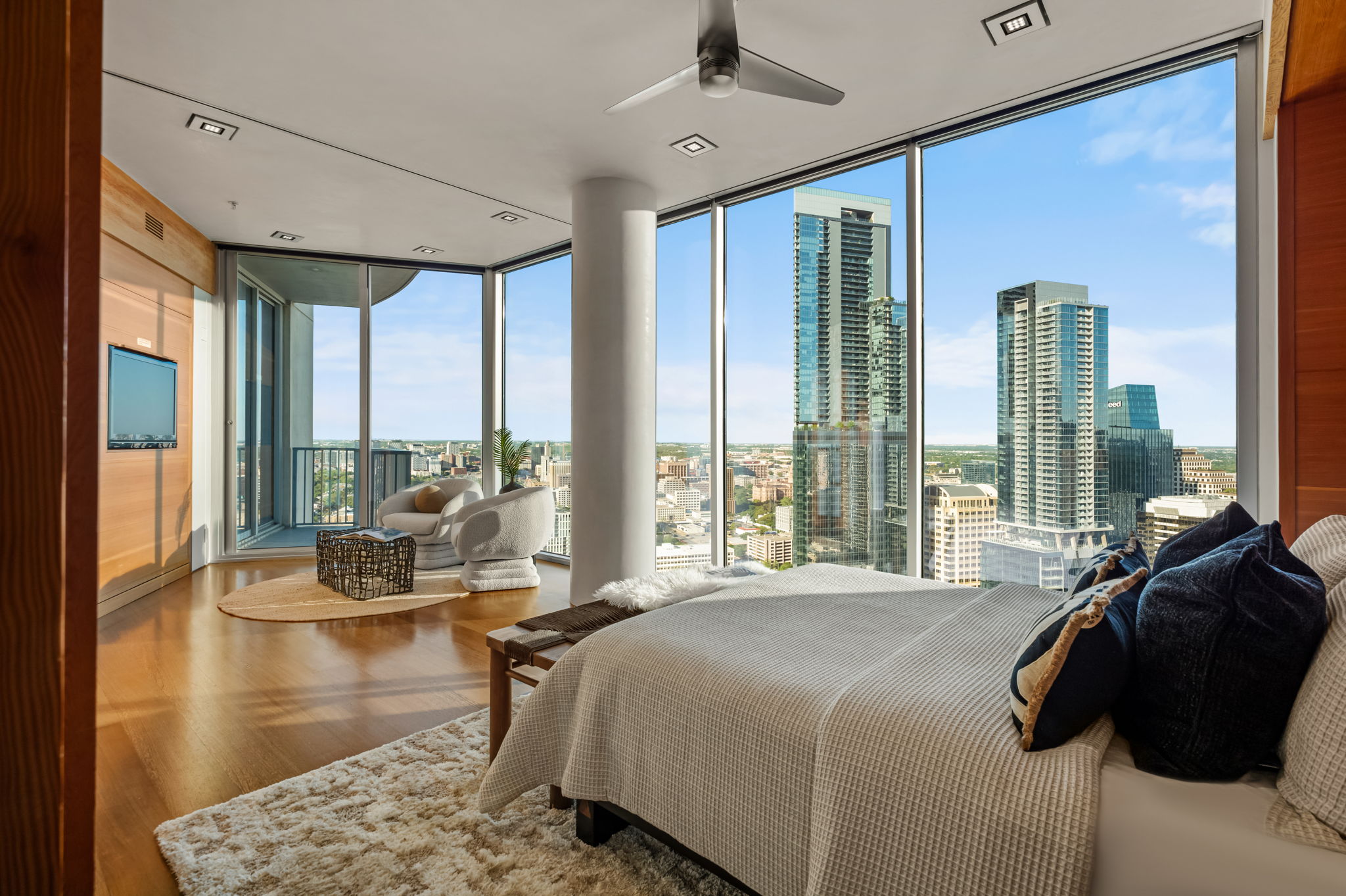 360 Nueces Street, Unit 4211 Austin, TX 78701 - Photo 24 of 40 a spacious bedroom with a large window and a bed