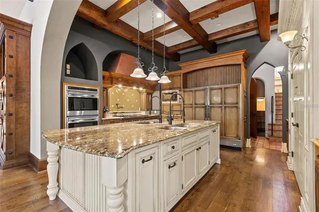 a view of living room with granite countertop furniture and wooden floor