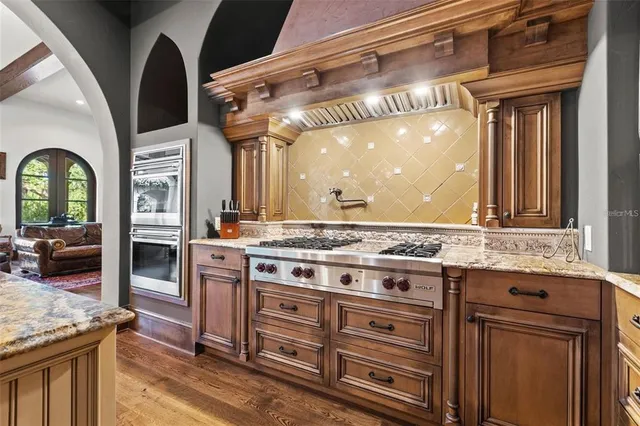 a kitchen with a granite countertop sink