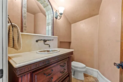 a living room with a bed furniture and a large window