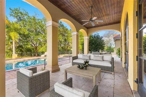 a view of pool with brick walls