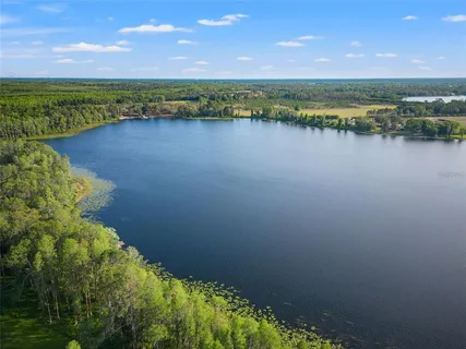 a view of a house with a big yard