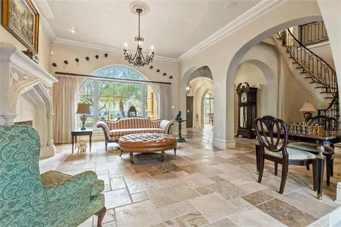 a view of a livingroom with furniture window and wooden floor