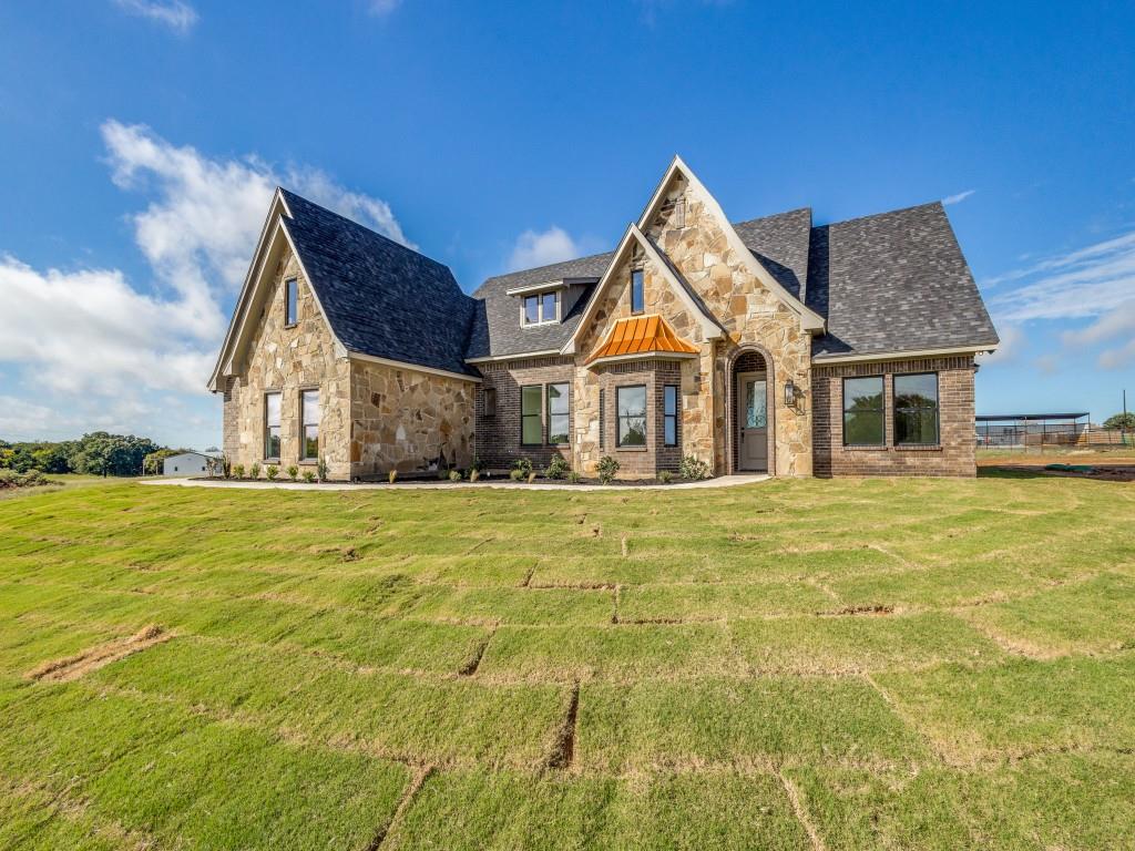 a view of a house with pool and ocean view