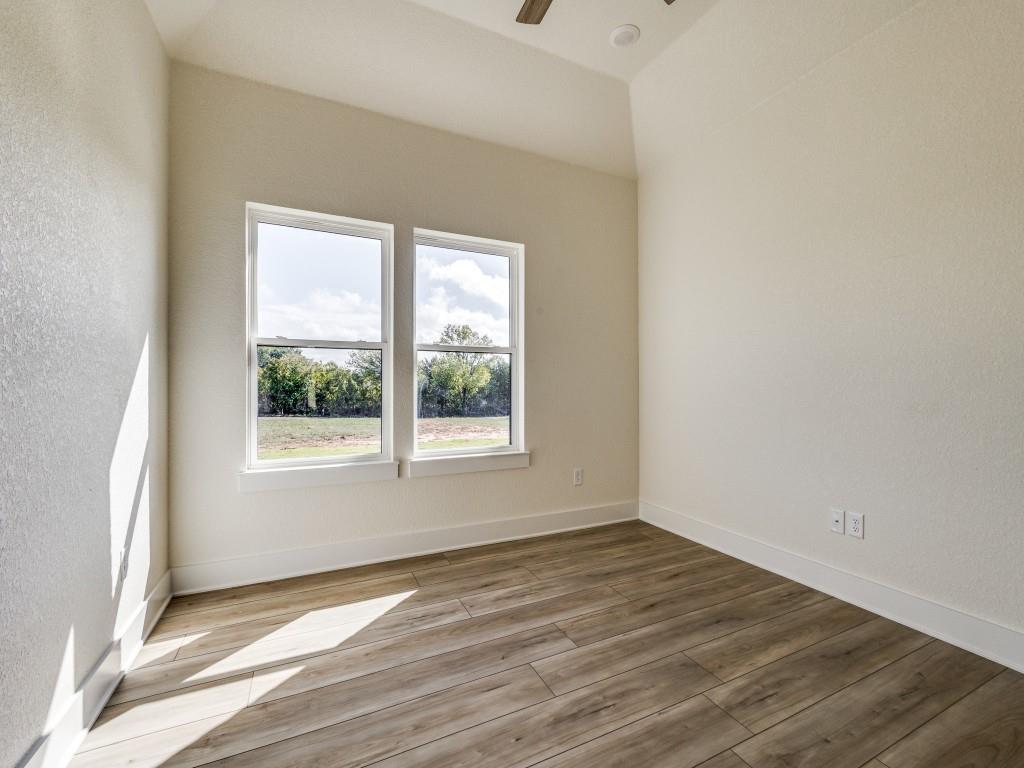 300 County Road 3141 Decatur, TX 76234 - Photo 18 of 25 a view of an empty room with wooden floor and a window