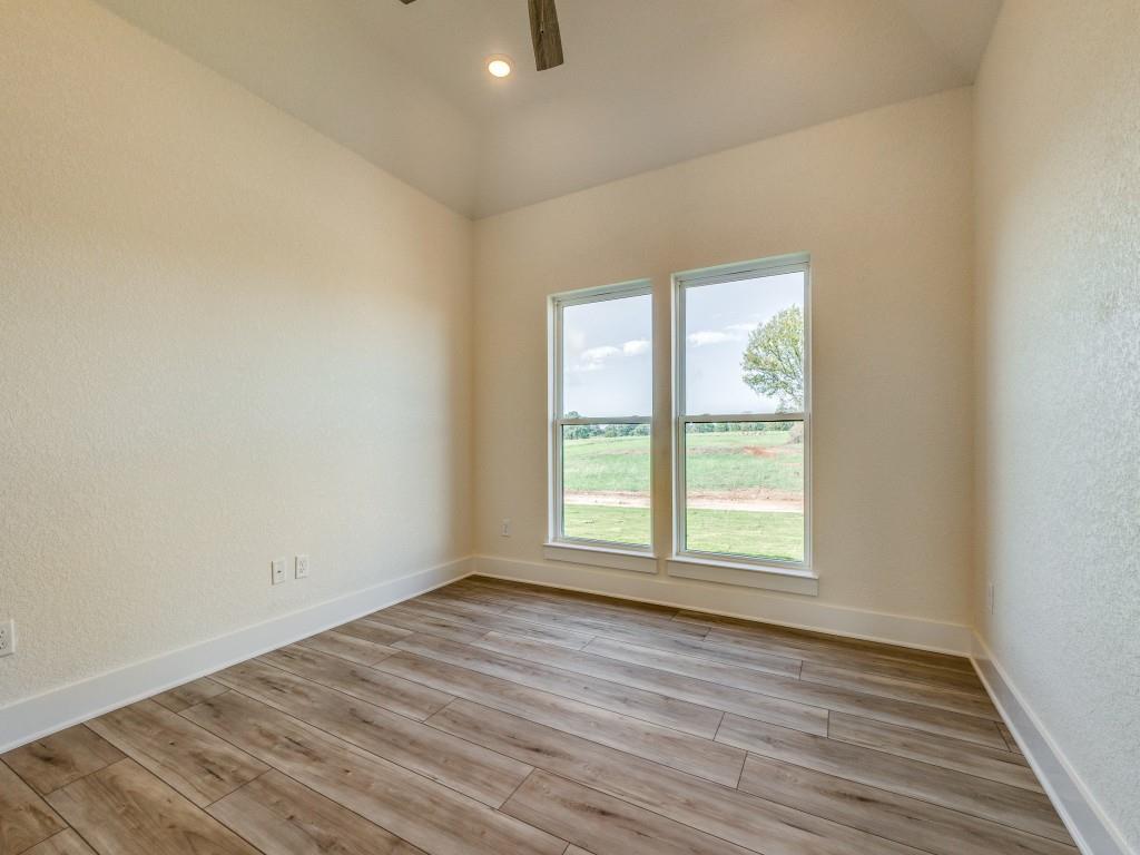300 County Road 3141 Decatur, TX 76234 - Photo 20 of 25 an empty room with wooden floor and windows