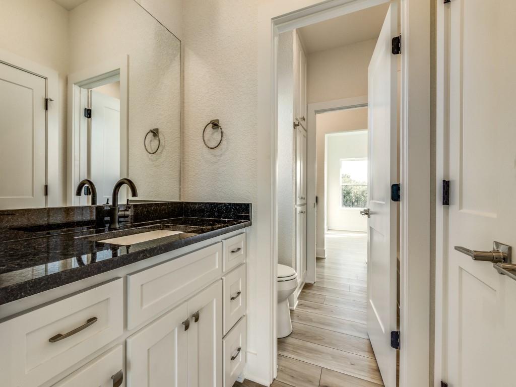 300 County Road 3141 Decatur, TX 76234 - Photo 21 of 25 a bathroom with a sink and a mirror