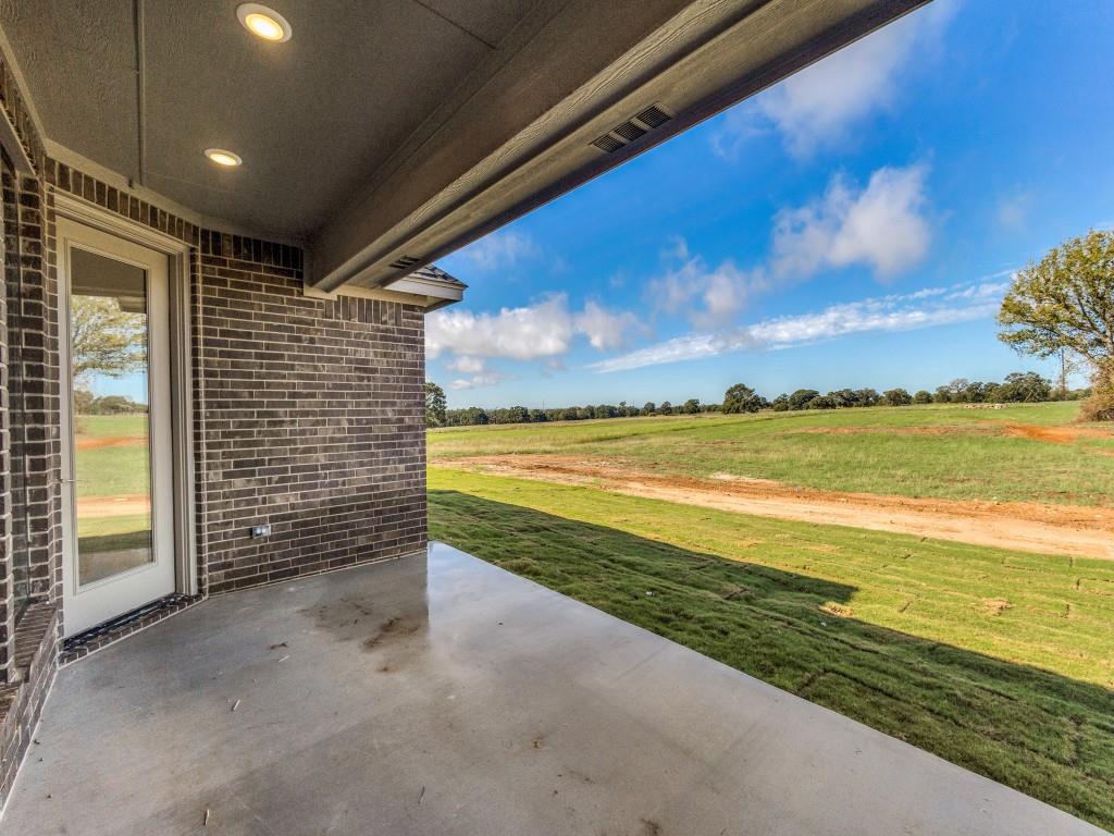 300 County Road 3141 Decatur, TX 76234 - Photo 23 of 25 a view of an empty room and a fireplace