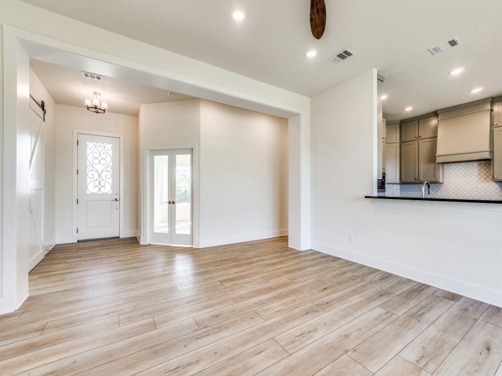300 County Road 3141 Decatur, TX 76234 - Photo 5 of 25 a view of an empty room with wooden floor and a window