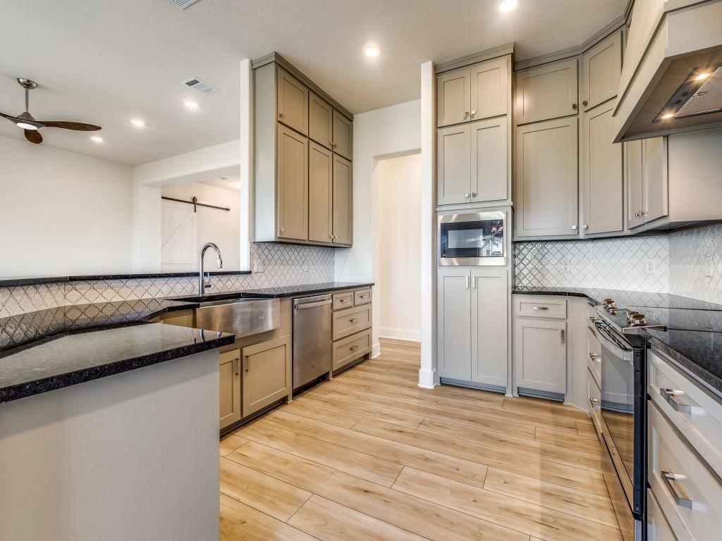 300 County Road 3141 Decatur, TX 76234 - Photo 10 of 25 a kitchen with stainless steel appliances granite countertop a sink stove and refrigerator