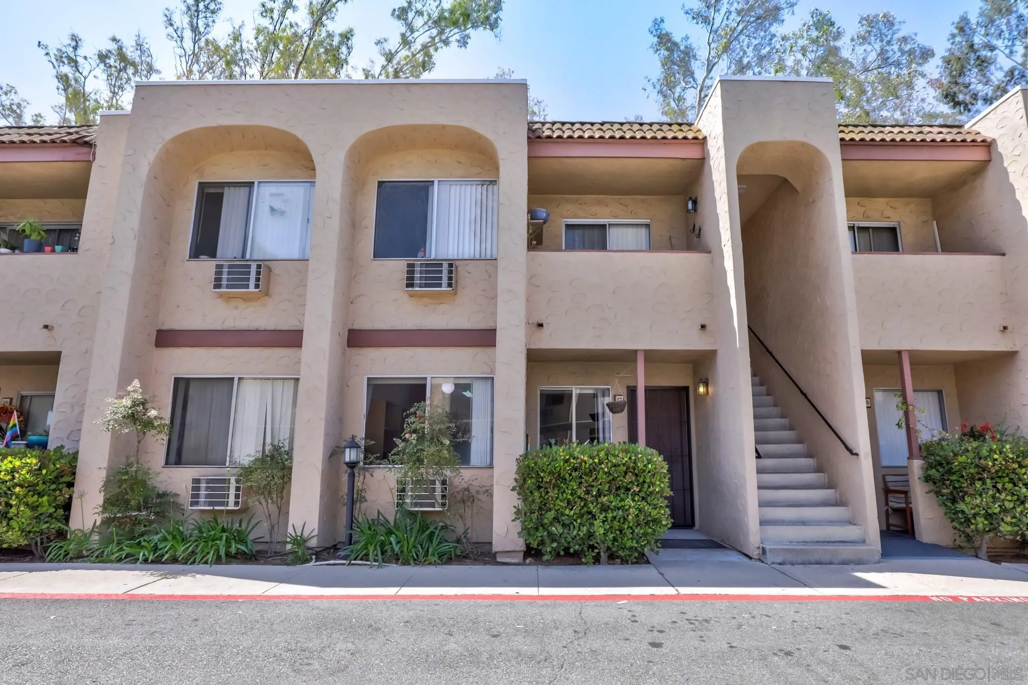 3557 Kenora Drive, Unit 17 Spring Valley, CA 91977 - Photo 1 of 8 front view of house with a yard