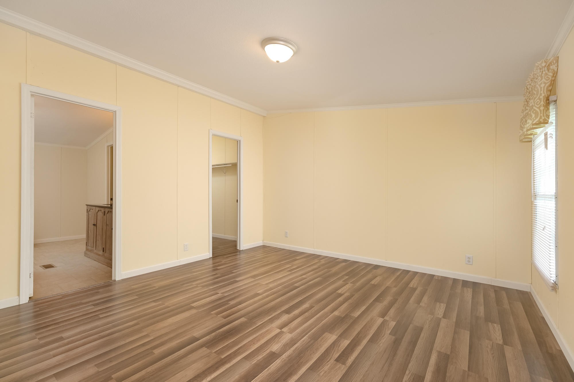 2666 Glass Mill Road Chickamauga, GA 30707 - Photo 16 of 28 an empty room with wooden floor and windows