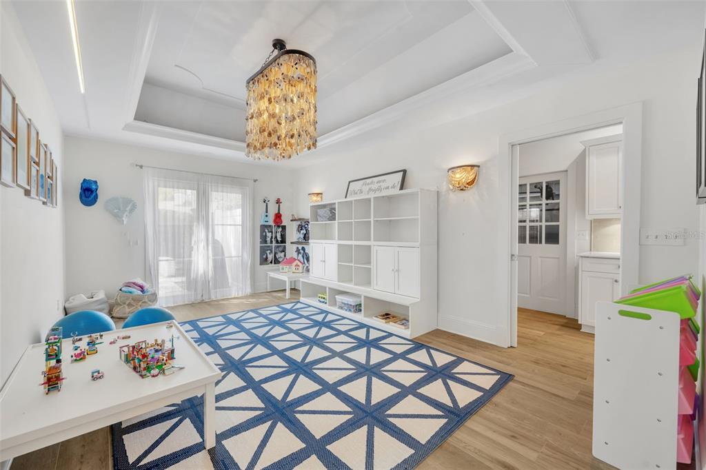 700 Pinetree Road Winter Park, FL 32789 - Photo 21 of 58 a bedroom with furniture and a window