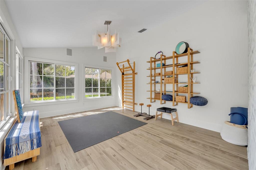700 Pinetree Road Winter Park, FL 32789 - Photo 23 of 58 a view of a room with wooden floor and windows