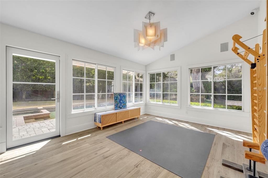 700 Pinetree Road Winter Park, FL 32789 - Photo 24 of 58 a view of a room with wooden floor and windows