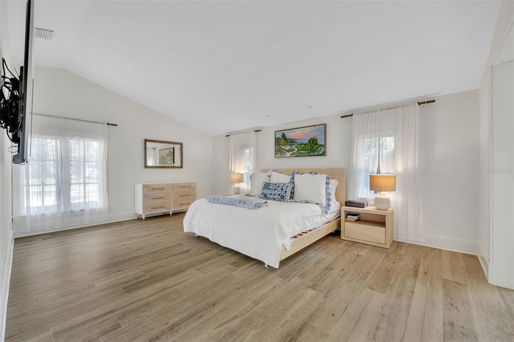700 Pinetree Road Winter Park, FL 32789 - Photo 27 of 58 a bedroom with a bed and a large window