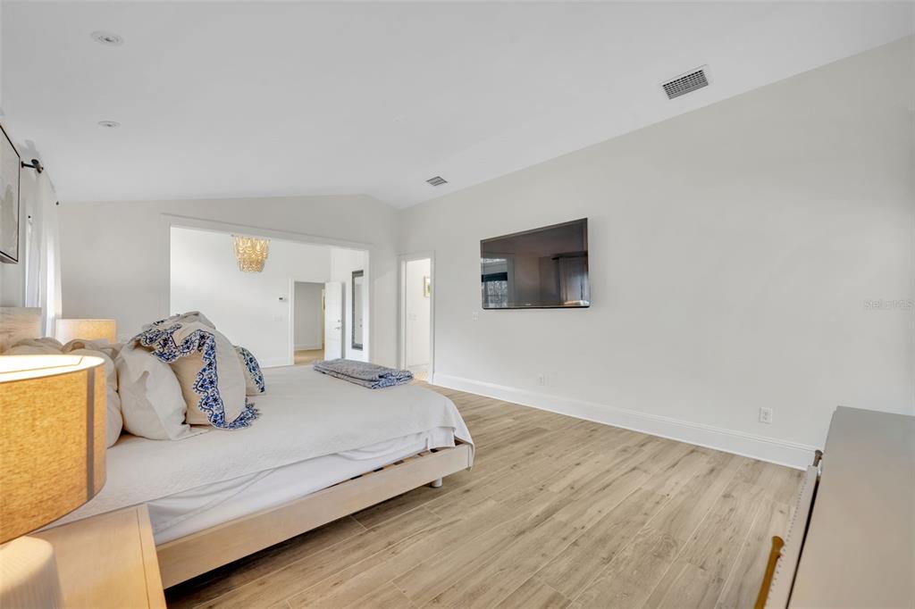 700 Pinetree Road Winter Park, FL 32789 - Photo 28 of 58 a bedroom with a bed and a couch