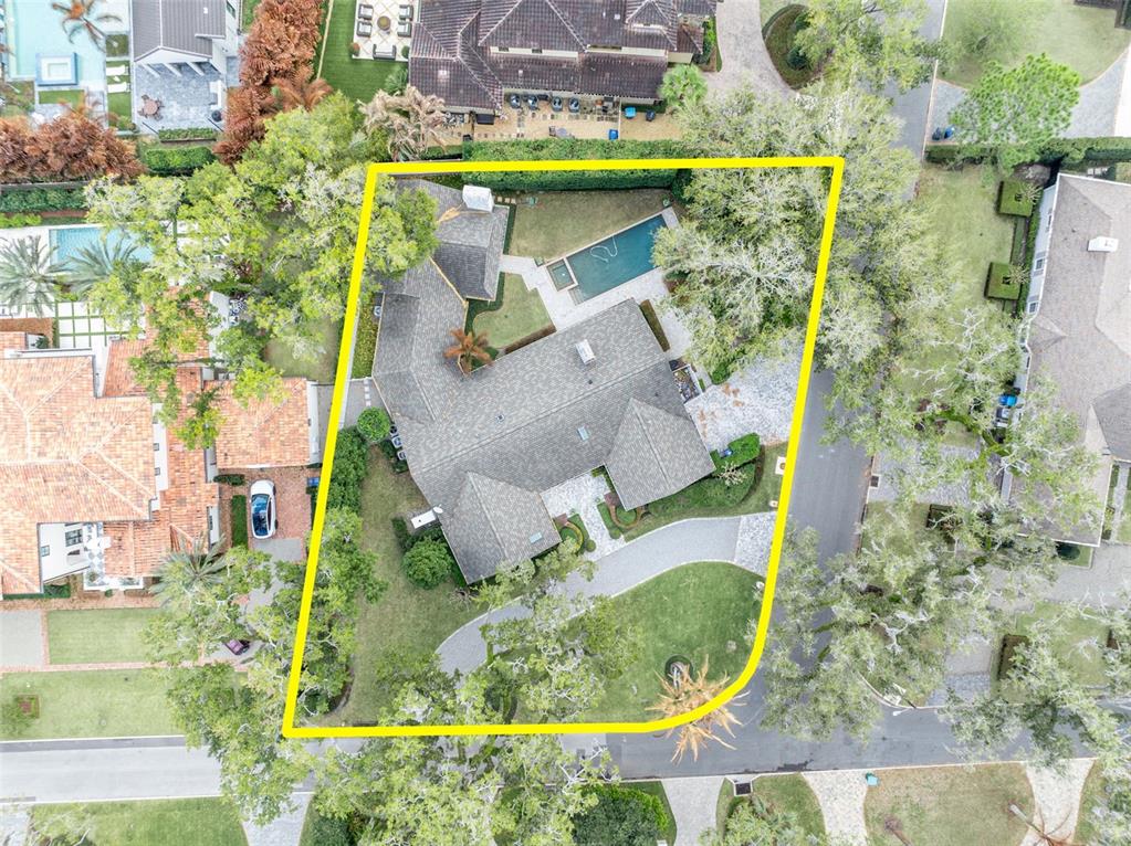 700 Pinetree Road Winter Park, FL 32789 - Photo 3 of 58 an aerial view of a house with a yard and swimming pool