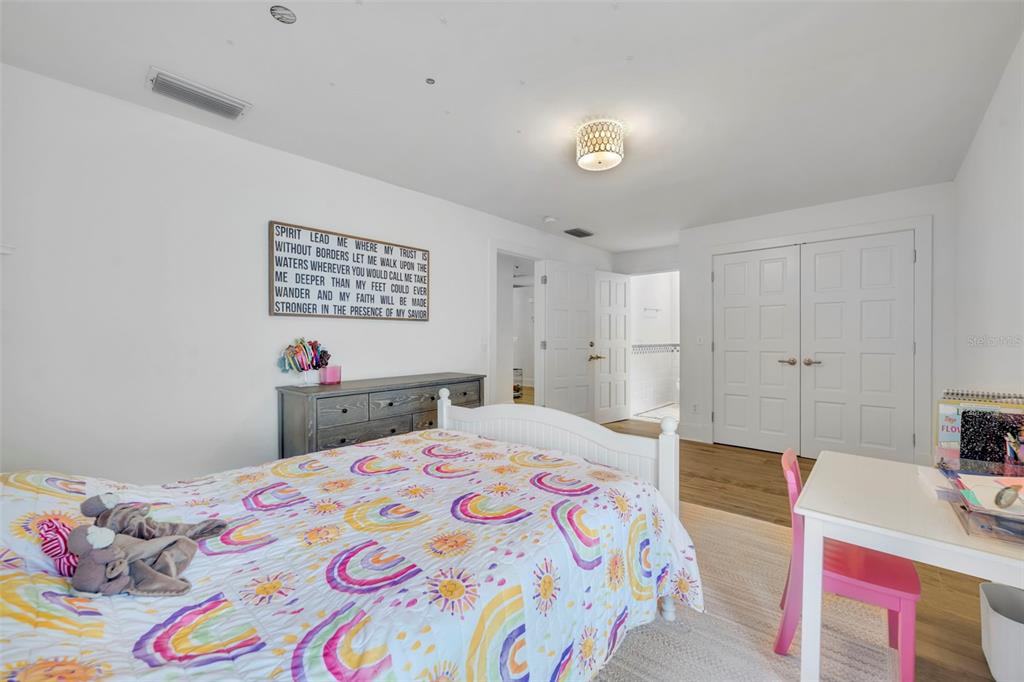 700 Pinetree Road Winter Park, FL 32789 - Photo 36 of 58 a bedroom with a bed and a dresser in it