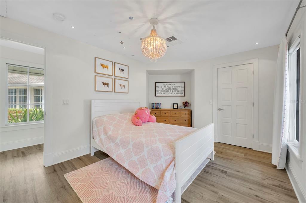 700 Pinetree Road Winter Park, FL 32789 - Photo 38 of 58 a bedroom with a bed and a window