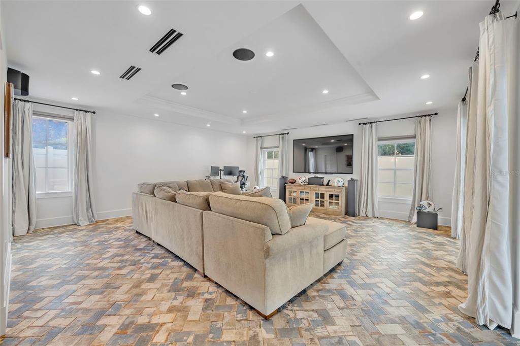700 Pinetree Road Winter Park, FL 32789 - Photo 41 of 58 a living room with furniture and a flat screen tv