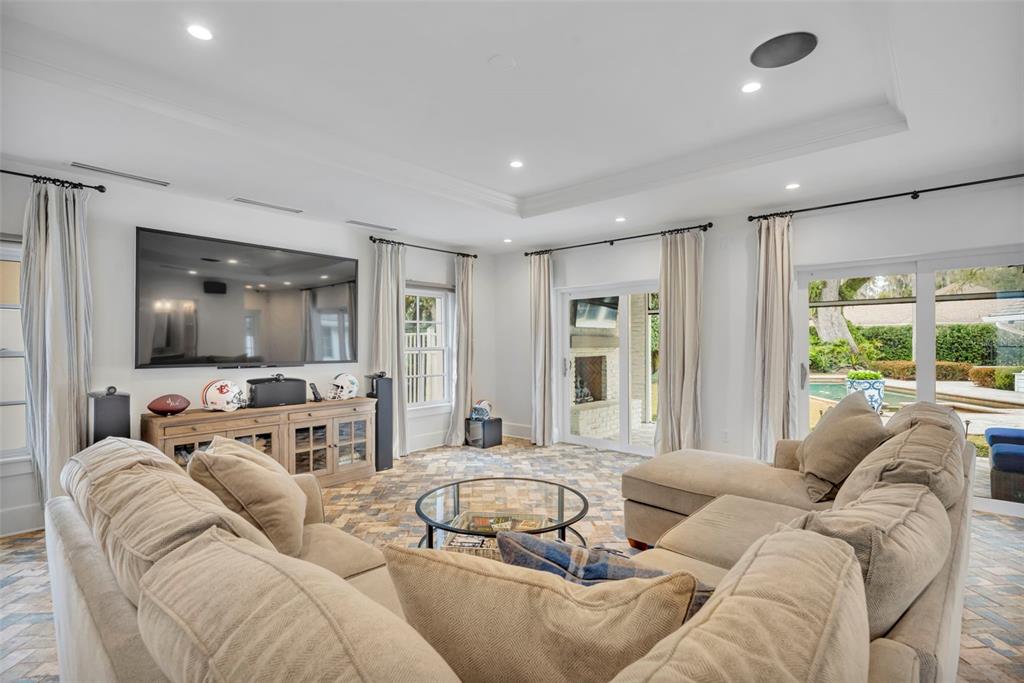 700 Pinetree Road Winter Park, FL 32789 - Photo 43 of 58 a living room with furniture and a flat screen tv