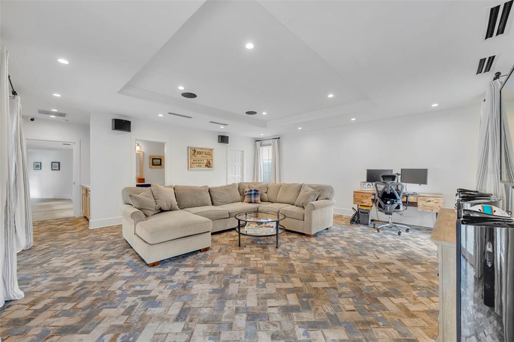 700 Pinetree Road Winter Park, FL 32789 - Photo 44 of 58 a living room with furniture and a flat screen tv