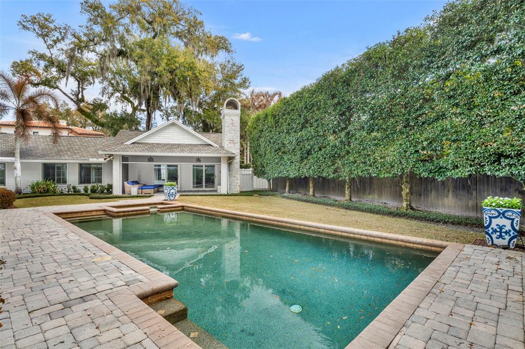 700 Pinetree Road Winter Park, FL 32789 - Photo 50 of 58 a house with swimming pool in front of it