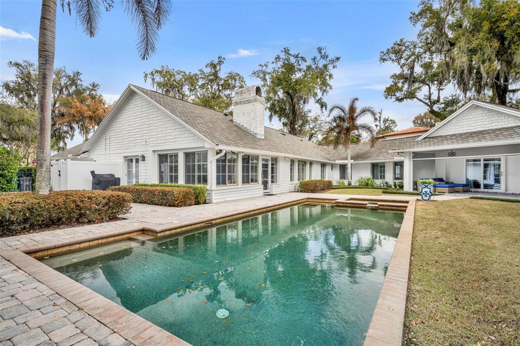700 Pinetree Road Winter Park, FL 32789 - Photo 52 of 58 a house with swimming pool in front of it