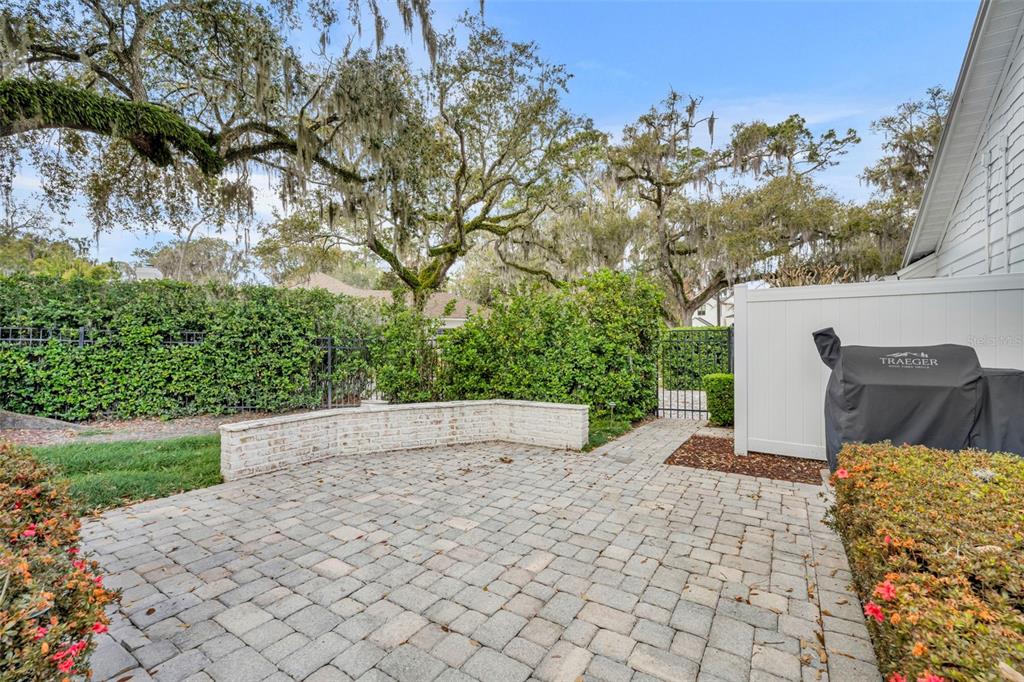700 Pinetree Road Winter Park, FL 32789 - Photo 53 of 58 a view of a yard with plants and trees