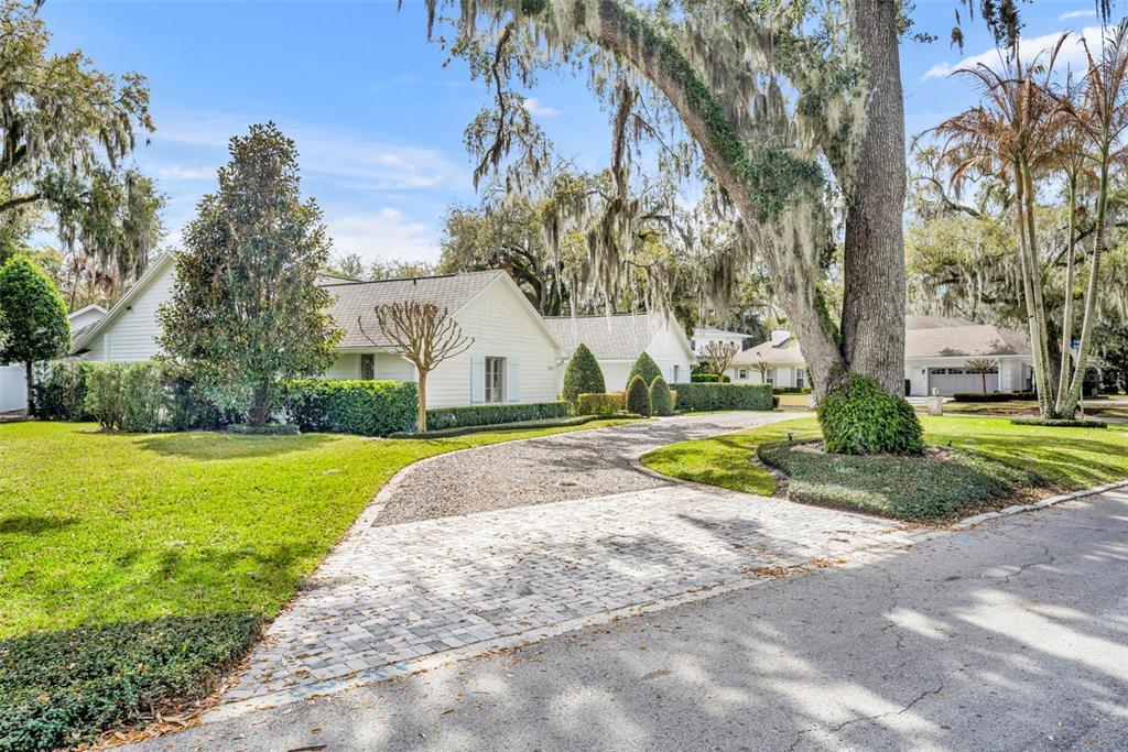 700 Pinetree Road Winter Park, FL 32789 - Photo 56 of 58 a view of a house with palm trees