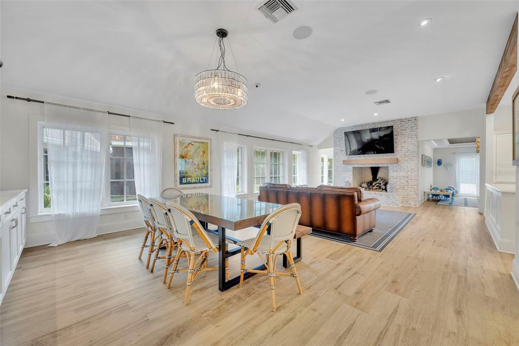 700 Pinetree Road Winter Park, FL 32789 - Photo 6 of 58 a living room with furniture wooden floor and a chandelier