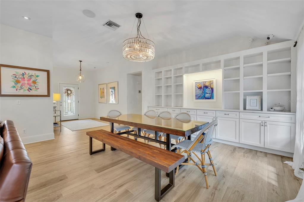 700 Pinetree Road Winter Park, FL 32789 - Photo 8 of 58 a living room with furniture a dining table and kitchen view
