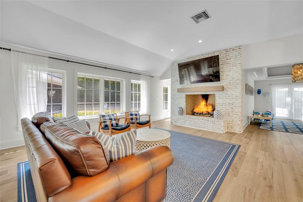 700 Pinetree Road Winter Park, FL 32789 - Photo 9 of 58 a living room with furniture and a flat screen tv