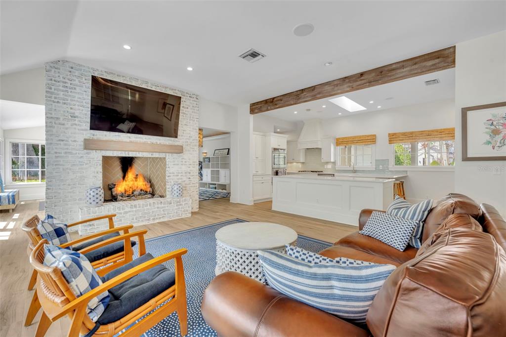 700 Pinetree Road Winter Park, FL 32789 - Photo 10 of 58 a living room with furniture and a flat screen tv