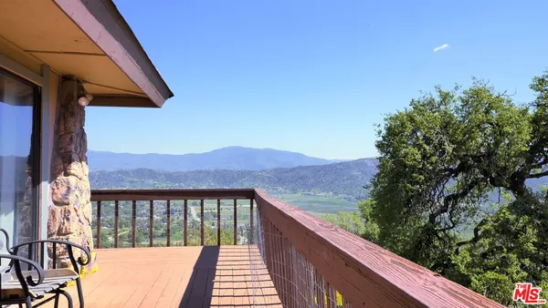 a view of a houses from a balcony