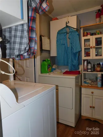 a living room with furniture tv and a large window