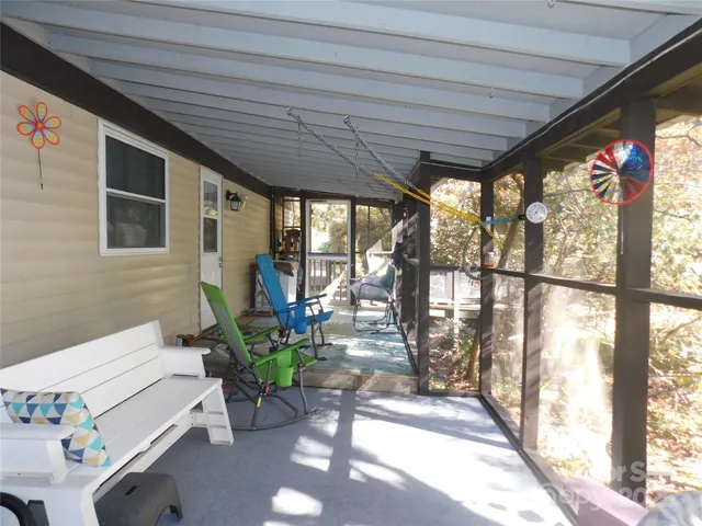 a view of a patio with table and chairs and potted plants