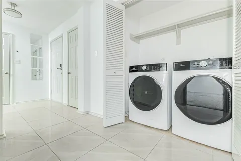 a kitchen that has a sink and a stove in it