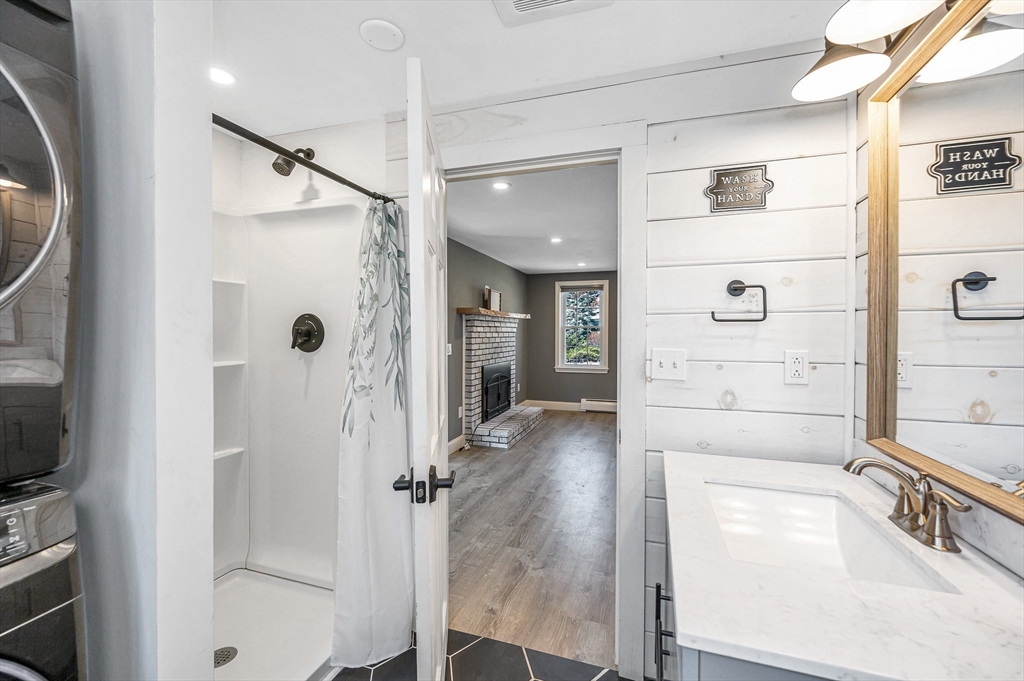 17 Autumn Street Windham, NH 03087 - Photo 17 of 42 a bathroom with a tub and shower