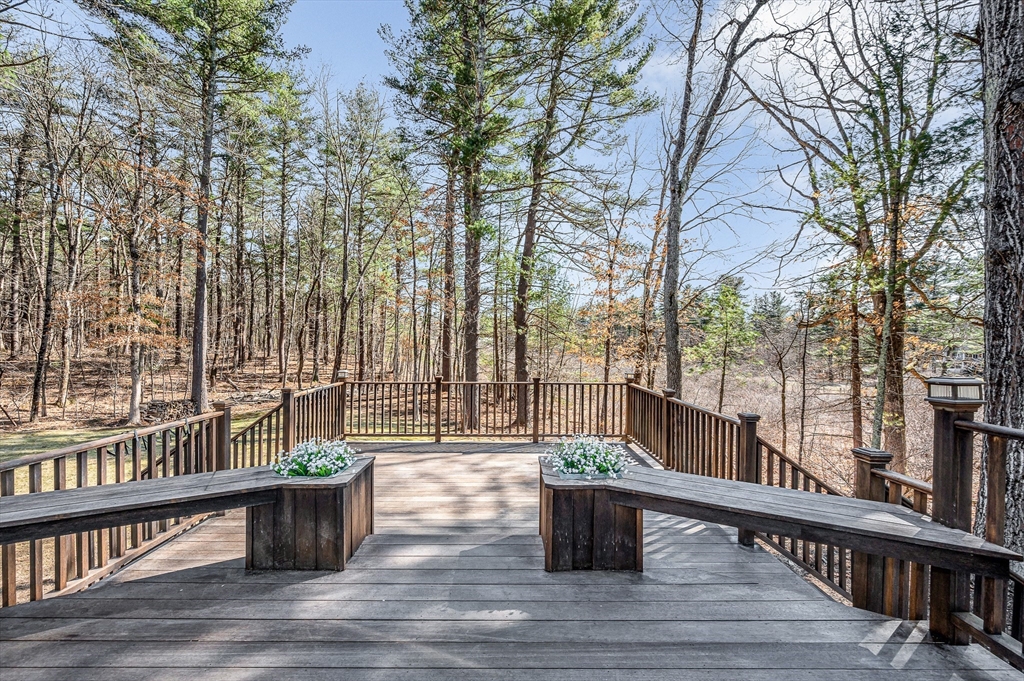 17 Autumn Street Windham, NH 03087 - Photo 19 of 42 a view of balcony with couch and wooden fence
