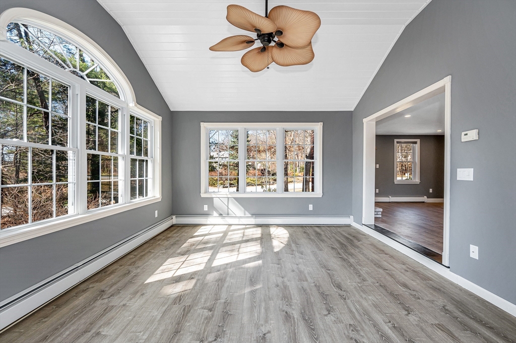 17 Autumn Street Windham, NH 03087 - Photo 23 of 42 a view of an empty room with a window and wooden floor