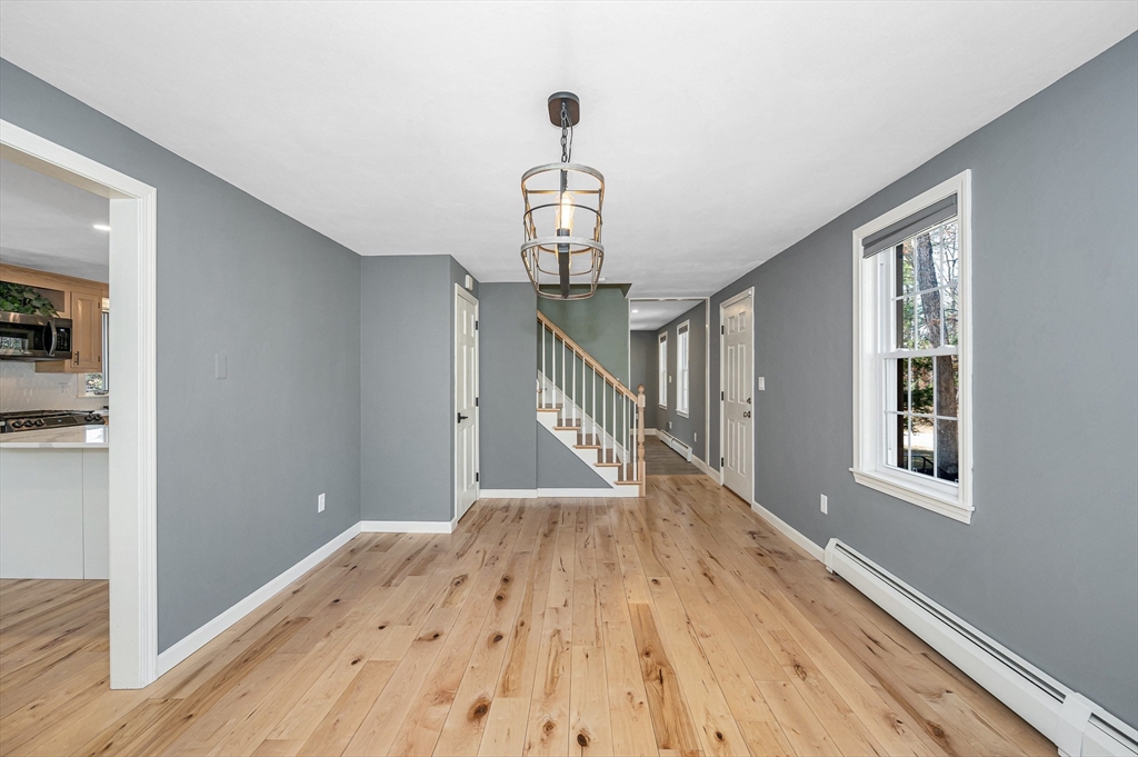 17 Autumn Street Windham, NH 03087 - Photo 24 of 42 a view of a hallway view with wooden floor and staircase