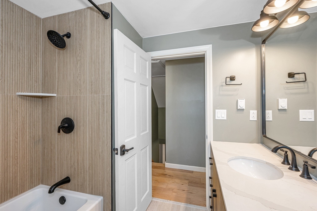 17 Autumn Street Windham, NH 03087 - Photo 29 of 42 a bathroom with a sink and a mirror