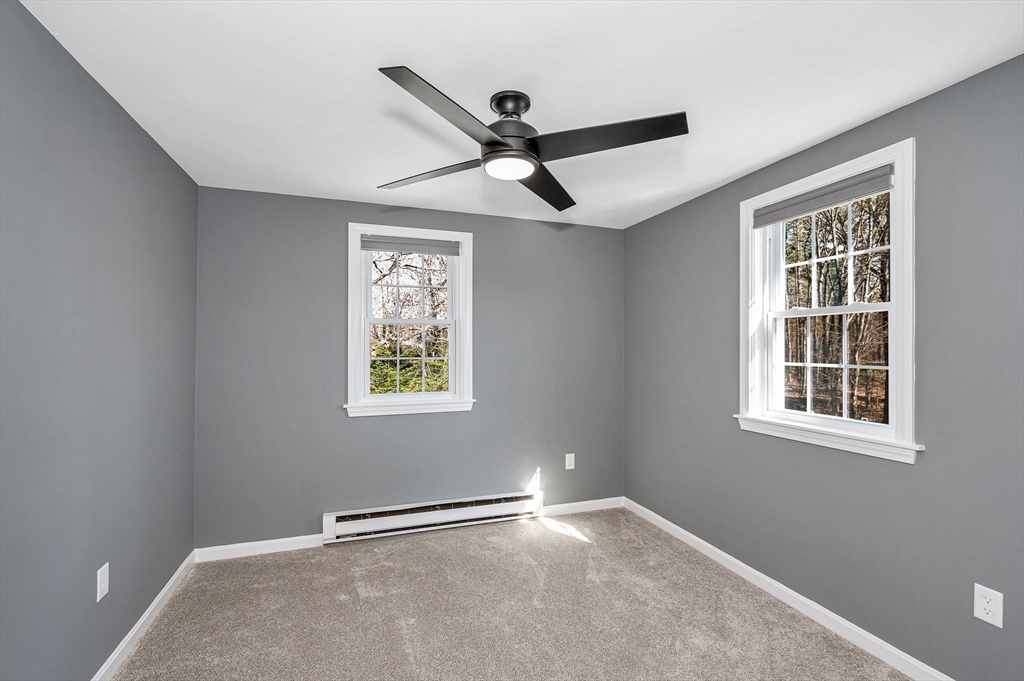 17 Autumn Street Windham, NH 03087 - Photo 30 of 42 an empty room with windows and fan