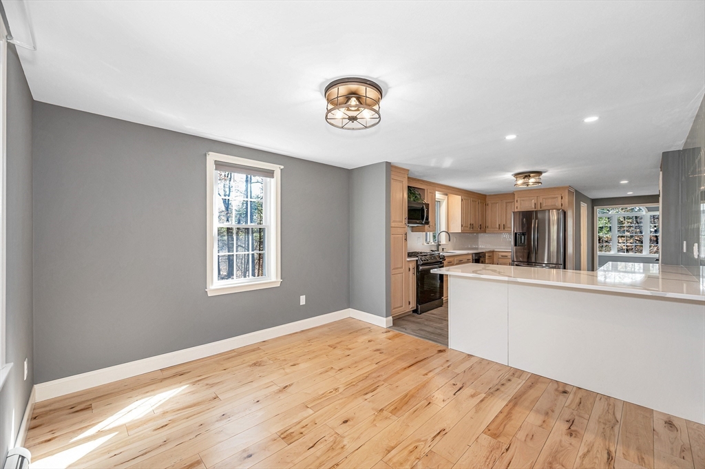 17 Autumn Street Windham, NH 03087 - Photo 7 of 42 a kitchen with a refrigerator and a sink