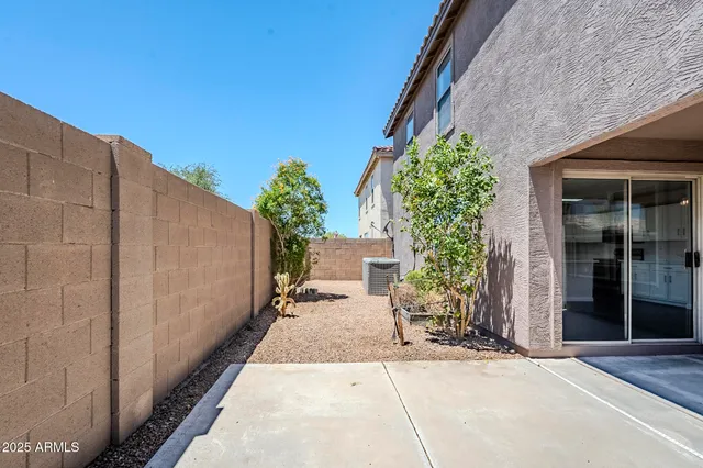 a path view of a house with a garden