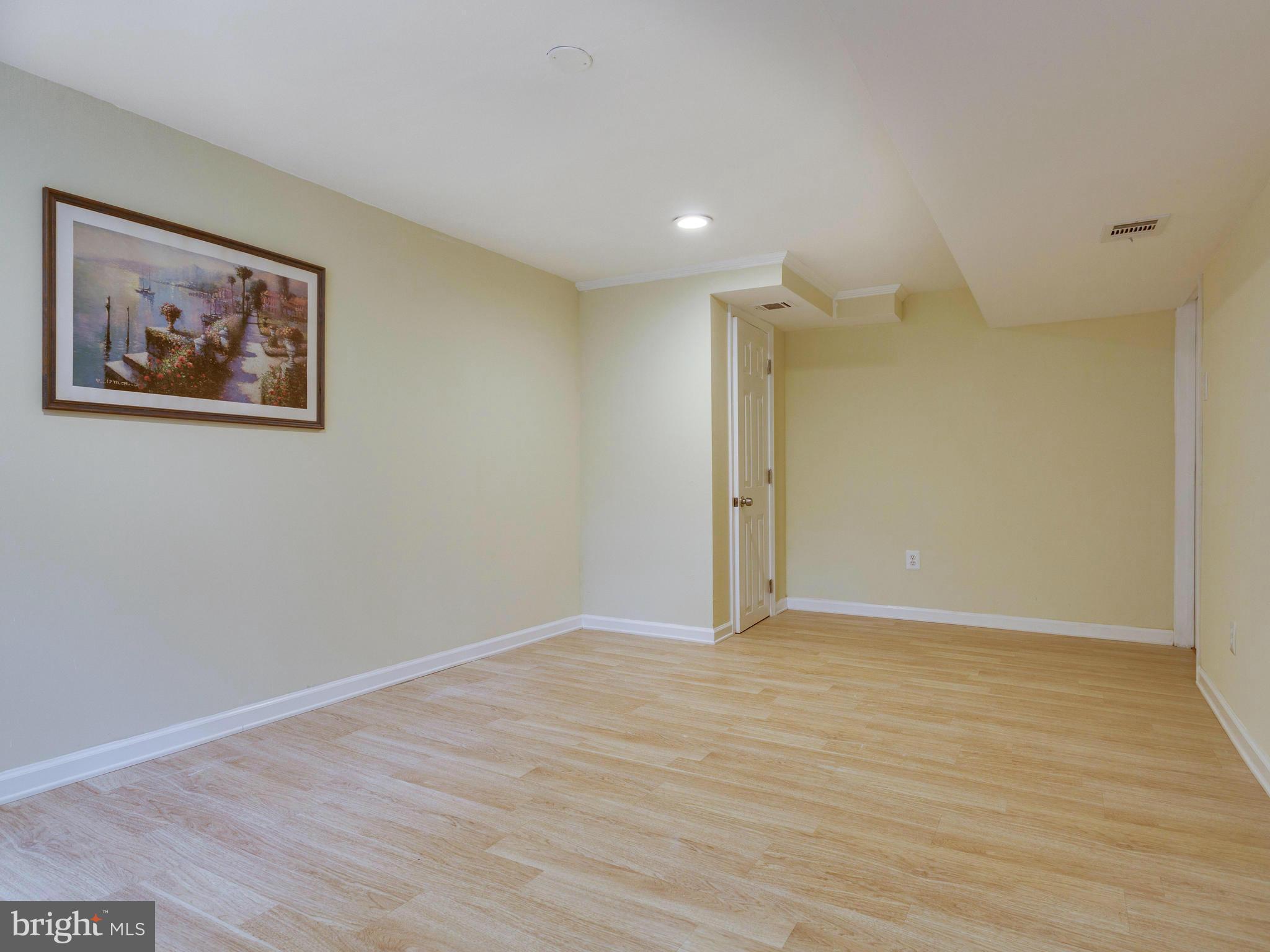 4002 Gannon Road Silver Spring, MD 20902 - Photo 22 of 30 a view of an empty room with wooden floor